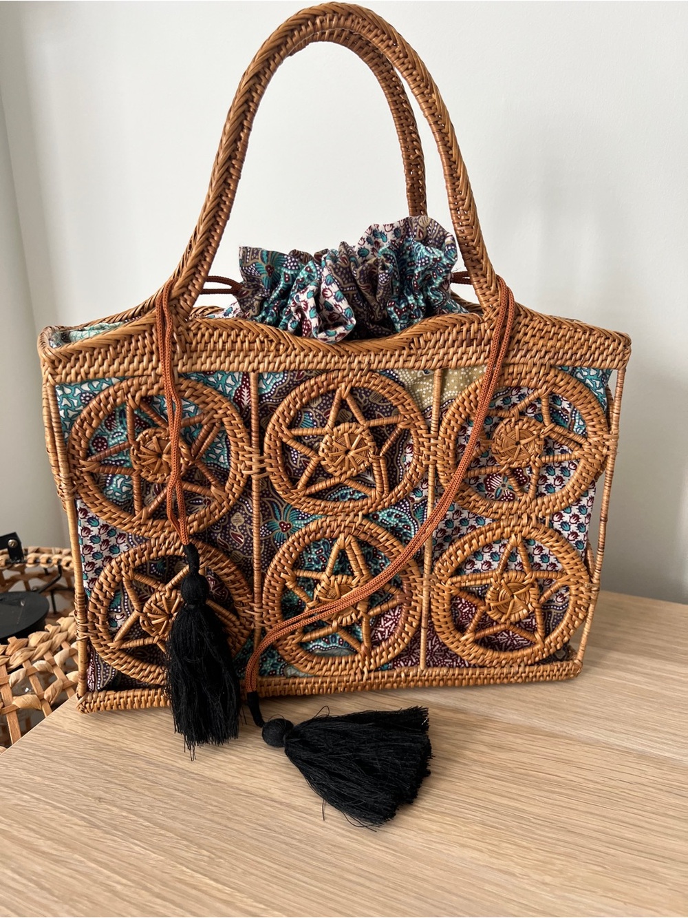Woven Rattan Tote Bag with Patterned Liner and Black Tassels